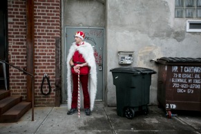 A Santacon reveler, stands outside a bar in Williamsburg, Brooklyn, on December 12, 2015.